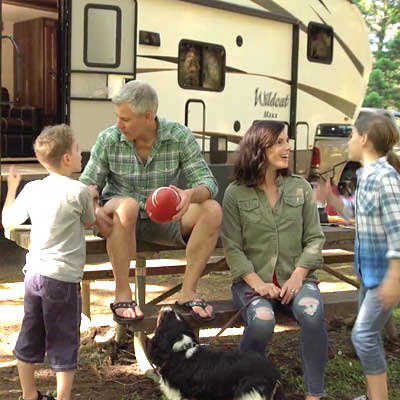 Family camping with their new RV from Sutton RV