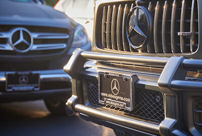 Close-up of the grill on two Mercedes-Benz of Eugene vehicles