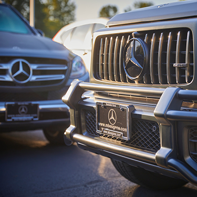 Close-up of the grill on two Mercedes-Benz of Eugene vehicles